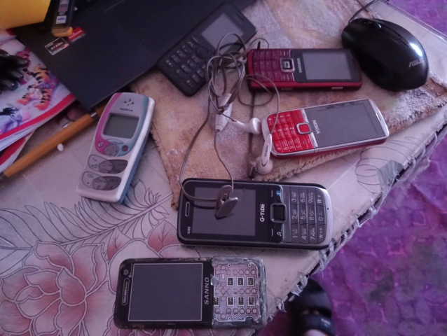 a lot of old phones with keypads and one without a keypad